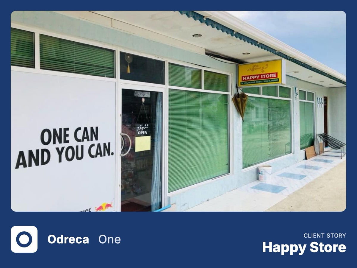 The Happy Store shopfront on Th. Hirilandhoo: green-blinded windows under a yellow Happy Store sign and an Open sign on the door